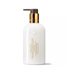 Load image into Gallery viewer, Mesmerising Oudh Accord &amp; Gold Hand Lotion
